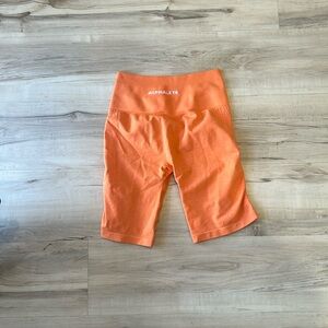 Alphalete orange bike shorts
